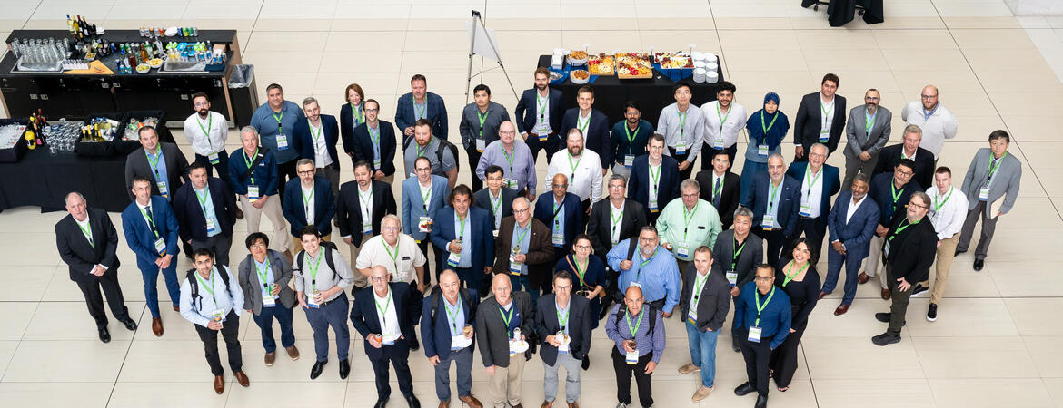 Attendees of the Fall 2026 North American Hydrogen Engine Conference gather for a group photo in the atrium at Huntington Place in Detroit.