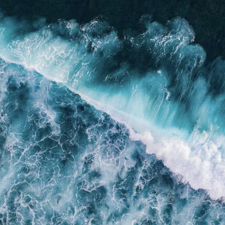 Drone photographs of salty sea water crashing on a beach (Getty Images). 