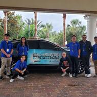 students standing in front of cadillac lyriq