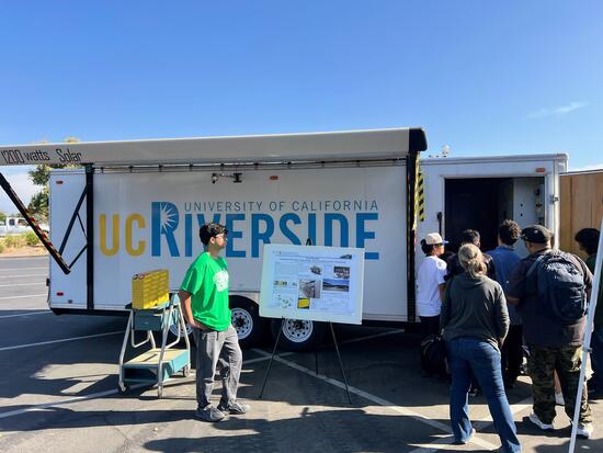 Students explore CE-CERT’s mobile battery and microgrid trailer.